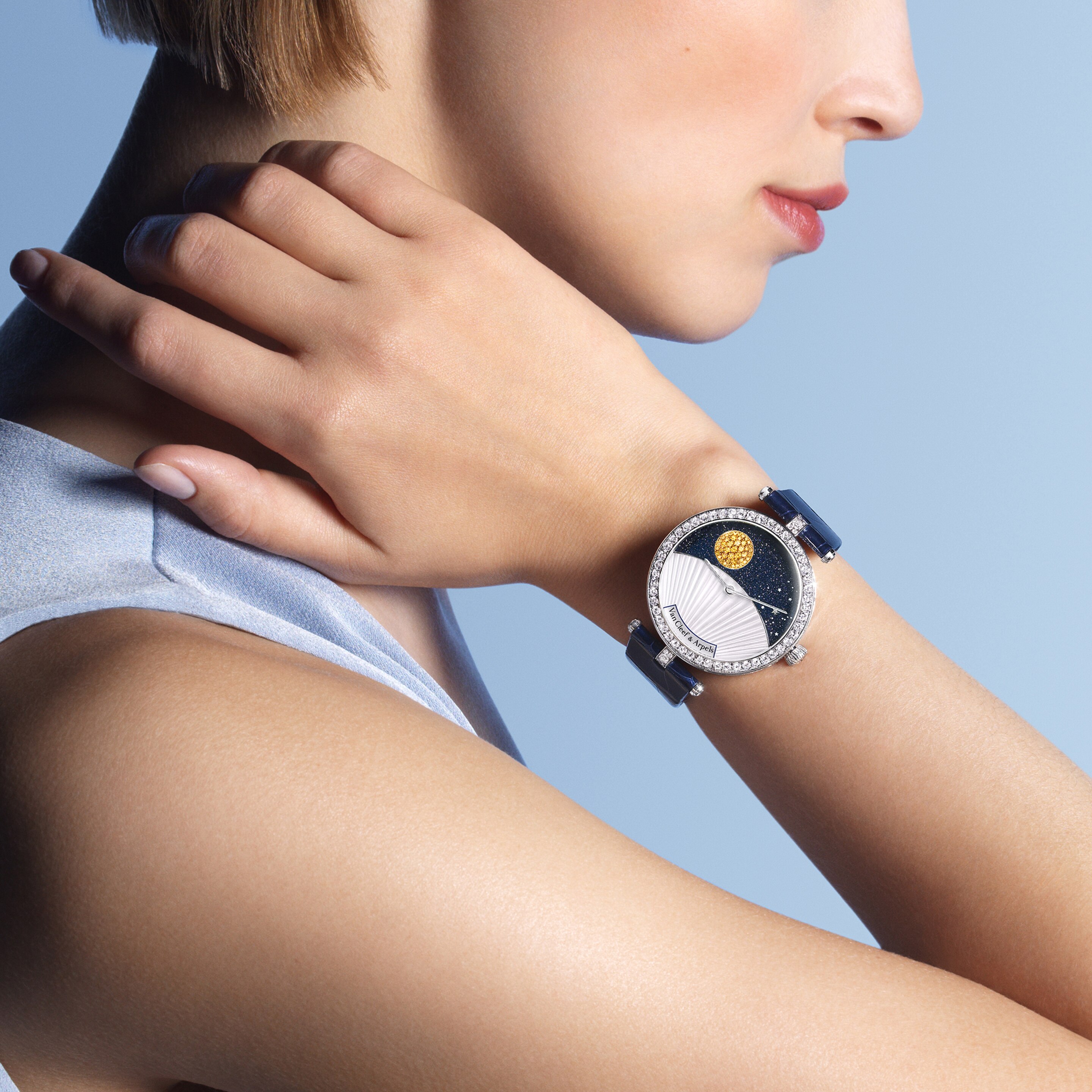 Lady Arpels Bal des Amoureux Automate watch. Rhodium plated 18K white gold, diamonds, enamel. Self-winding mechanical movement, retrograde, automaton and on-demand animation. Poetic Complications® collection, Van Cleef & Arpels.