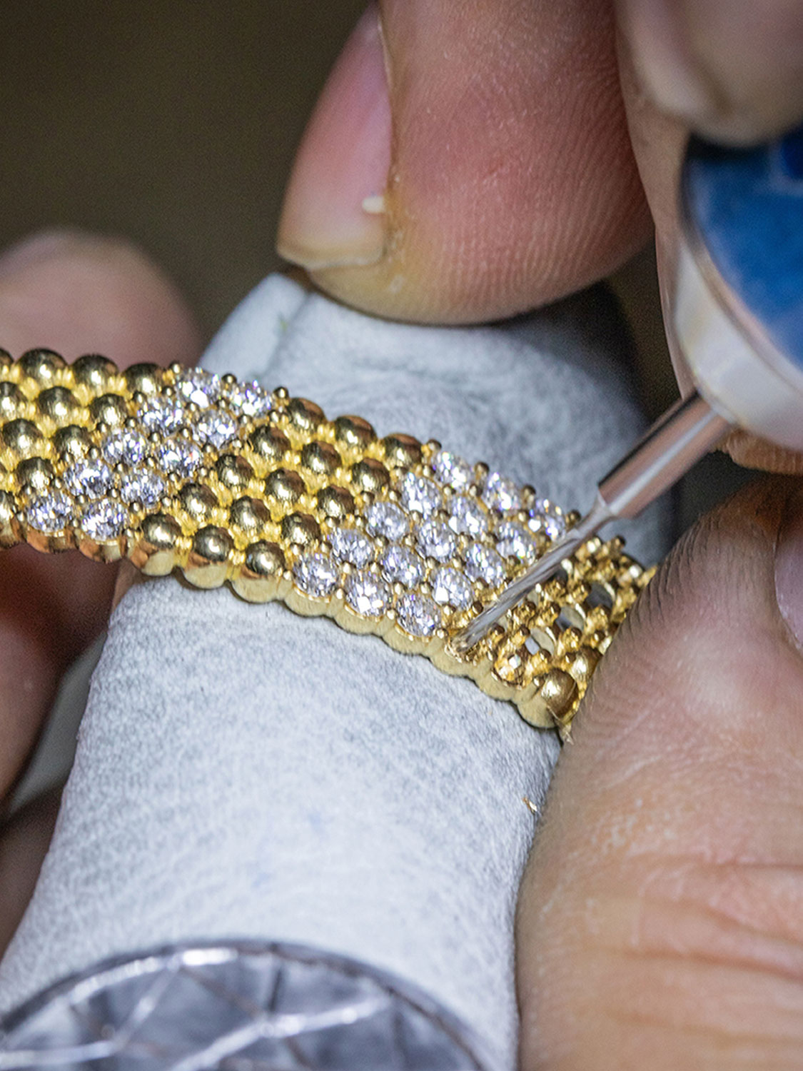 Nail setting work, Perlée collection, Van Cleef & Arpels.