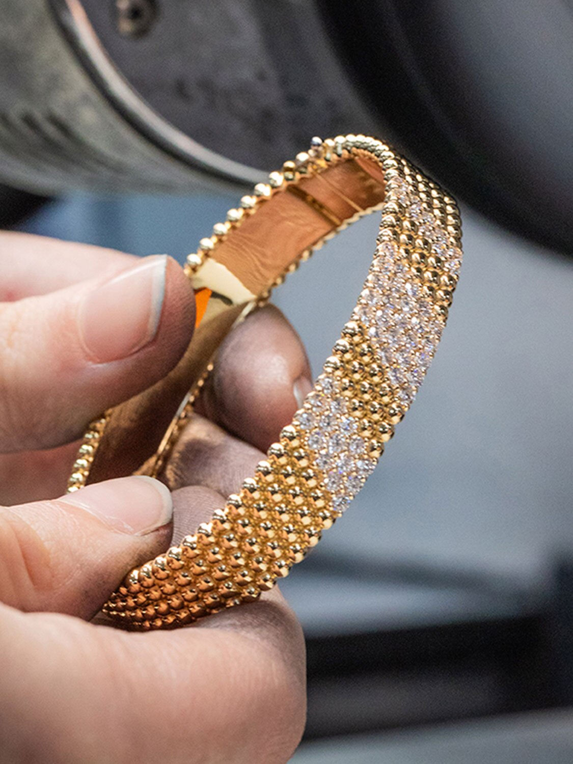 Final polishing work, Perlée collection, Van Cleef & Arpels.