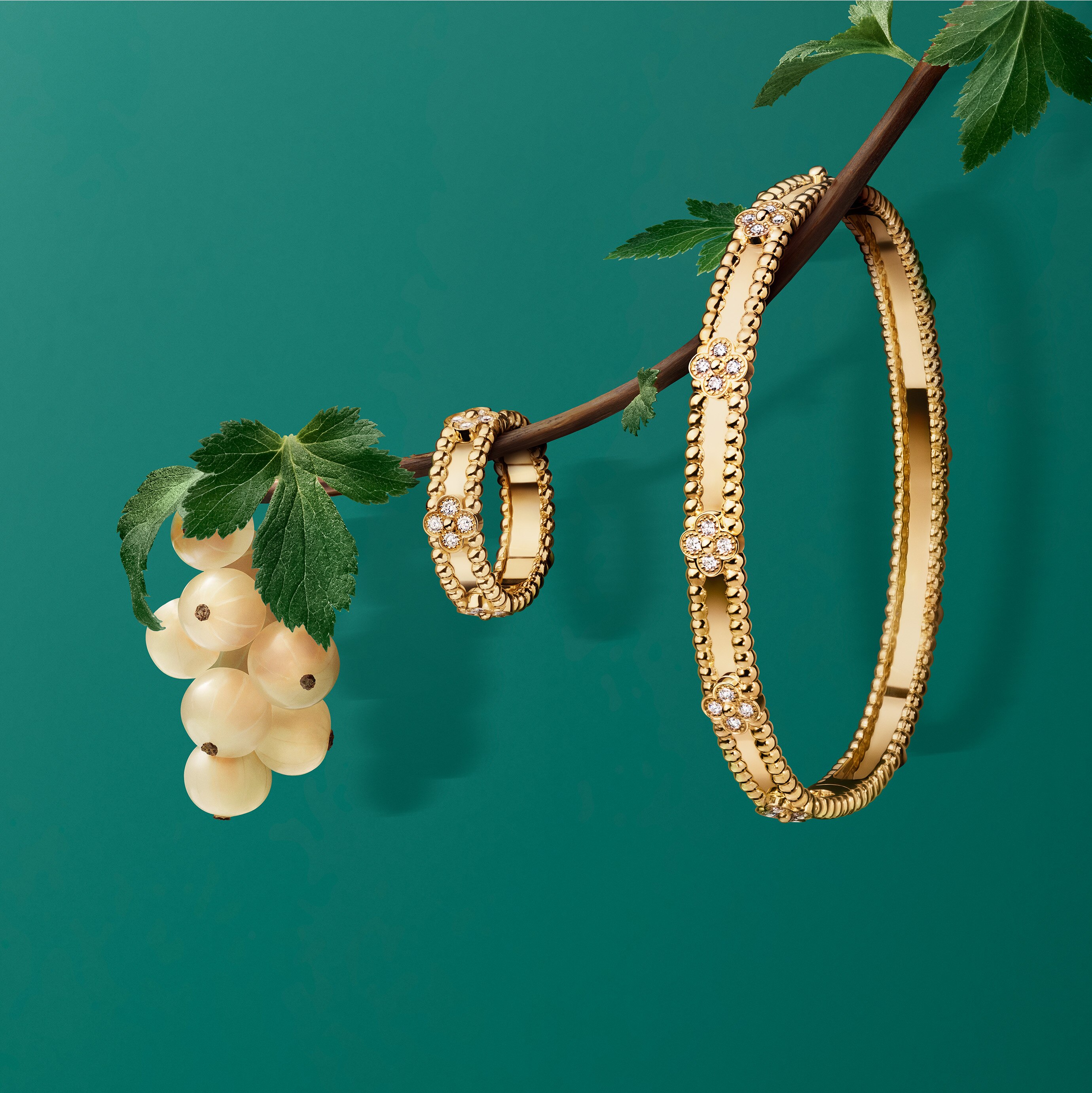 Perlée sweet clovers bracelet and ring, 18K yellow gold, diamonds. Perlée® collection, Van Cleef & Arpels.